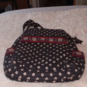 Small Vera  Bradley backpack 14" x 12" black and tan print w/ red print lining